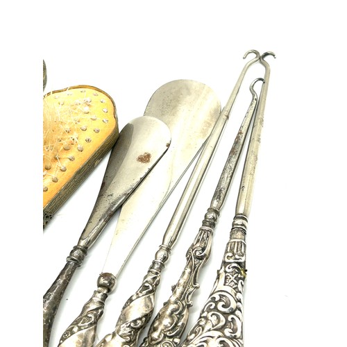 109 - Antique silver handle shoe horns/ button hooks and petit point vanity set