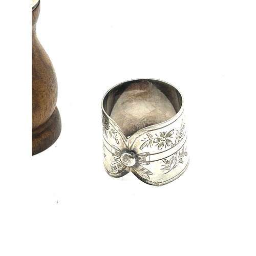 427 - Sterling silver top pepper grinder and pair of silver plated shirt collar napkin rings