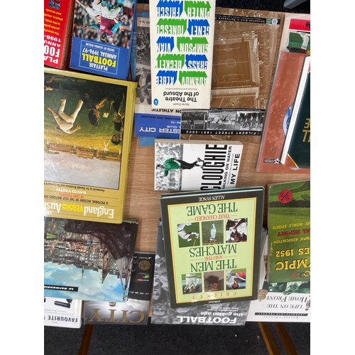 169 - Large selection of sport related books includes cricket, football etc