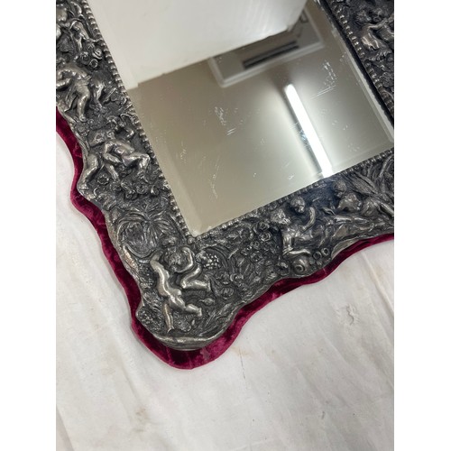 457 - Ornate silver plated mirror with cherrub design measures approx 15 inches tall by 13 width