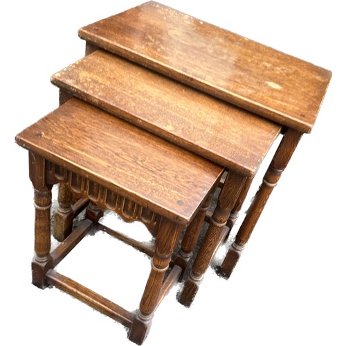 368 - Oak nest of three tables largets measures approximately 19 inches tall