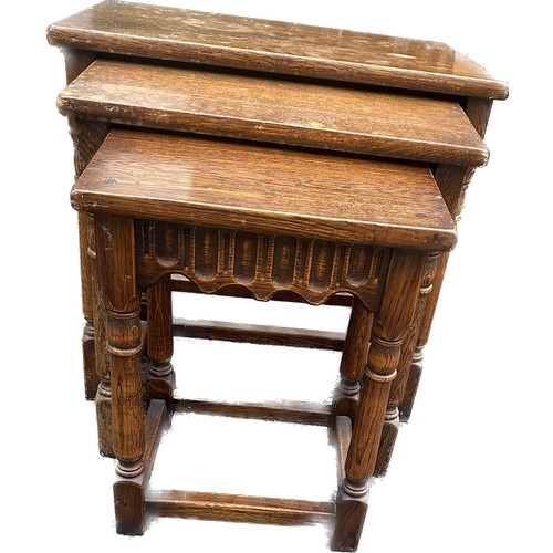 368 - Oak nest of three tables largets measures approximately 19 inches tall