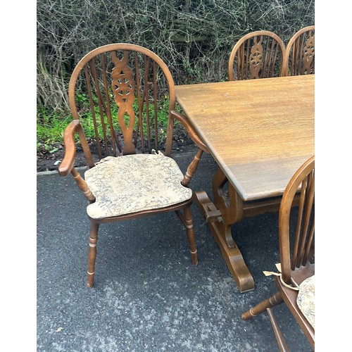 369 - old charm oak rectory table and 6 wheel back chairs including 2 carvers