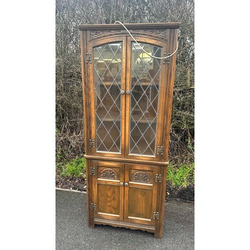 365 - Vintage old charm corner cabinet with lights measures approximately 66 inches tall