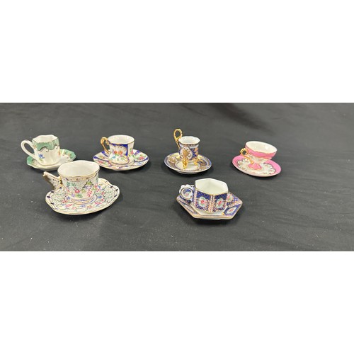 92 - Selection of miniature cups and saucers