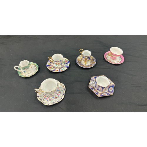 92 - Selection of miniature cups and saucers