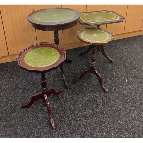 331 - 4 Leather topped wine occasional tables largest measures approximately 18 inches diameter 25 inches ... 