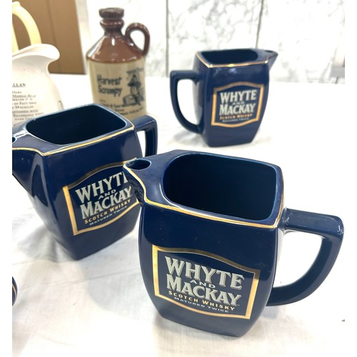 140 - Selection of advertising jugs includes Bells, Whyte Mackay etc