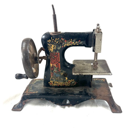 62 - Antique tin miniature sewing machine