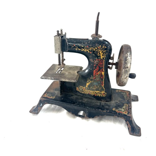 62 - Antique tin miniature sewing machine