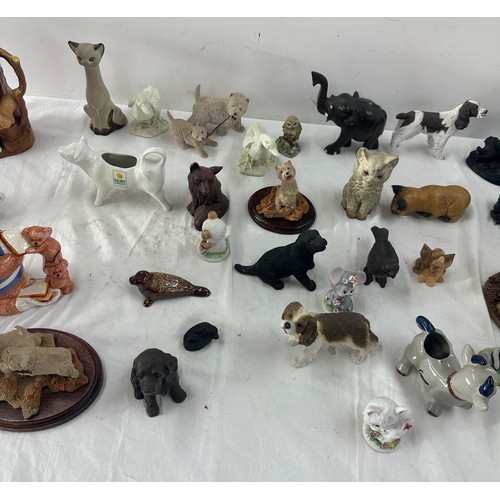 153 - Large selection of animal figures includes cats, dogs etc