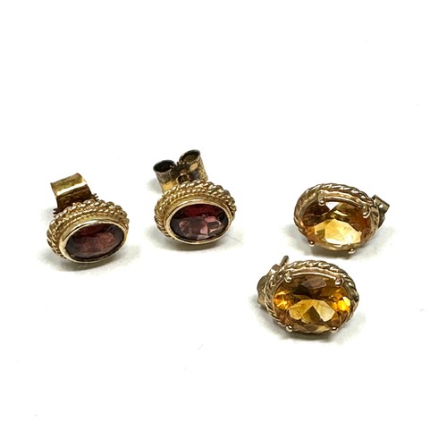 155 - 2x 9ct gold citrine & garnet stud earrings (3.7g)