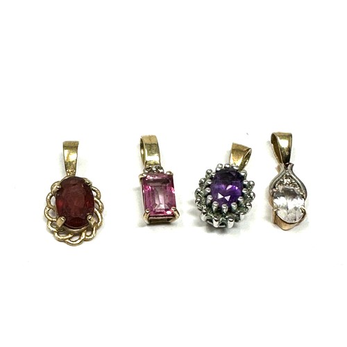 149 - 4x 9ct gold diamond, amethyst, garnet, pink topaz & white gemstone pendant (2.7g)