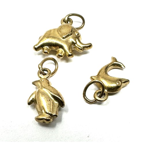 224 - 3 x 9ct gold animal charms inc.elephant, dolphin & penguin 1g