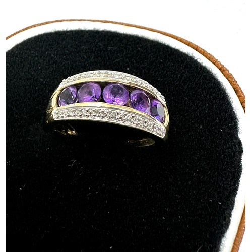 217 - 9ct gold amethyst five stone ring with diamond frame (3.2g)