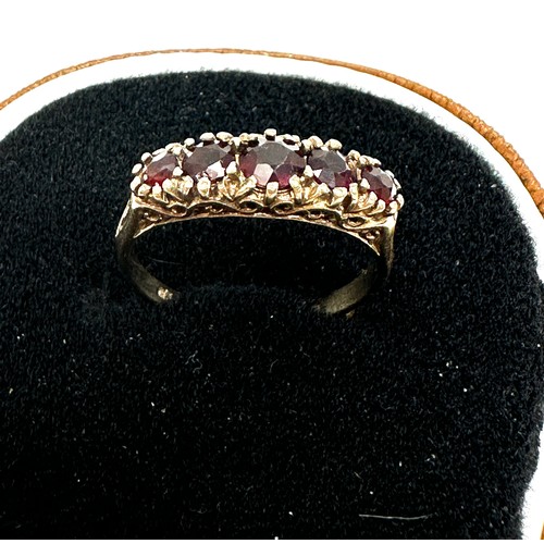 232 - 9ct gold garnet five stone ring (2.8g)