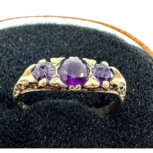 238 - 9ct gold amethyst three stone ring (2.6g) stones damaged