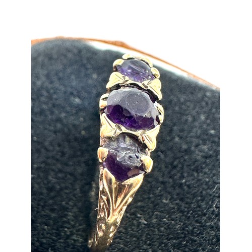 238 - 9ct gold amethyst three stone ring (2.6g) stones damaged