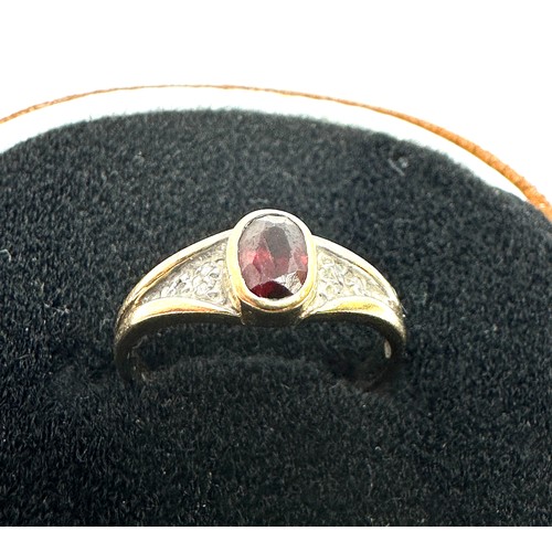 228 - 9ct gold garnet ring with diamond shoulders  (2g)