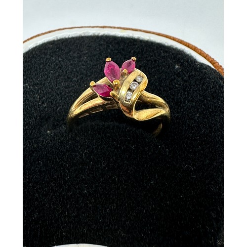 235 - 9ct gold diamond & ruby dress ring (2.7g)