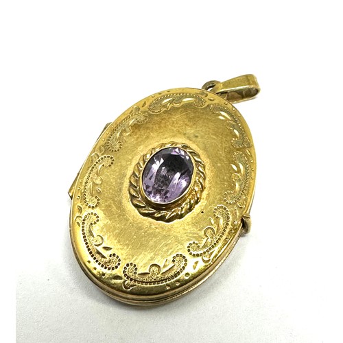 211 - 9ct gold amethyst oval locket pendant (4.2g)