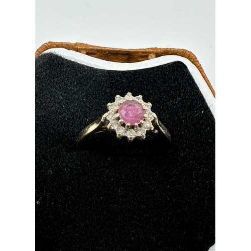 214 - 9ct gold diamond & ruby oval cluster ring (2.1g)