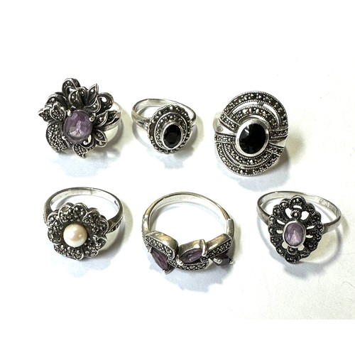 325 - A collection of silver marcasite rings including Amethyst (31g)