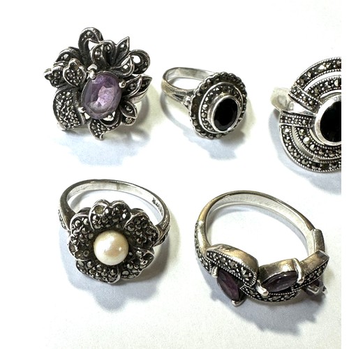 325 - A collection of silver marcasite rings including Amethyst (31g)