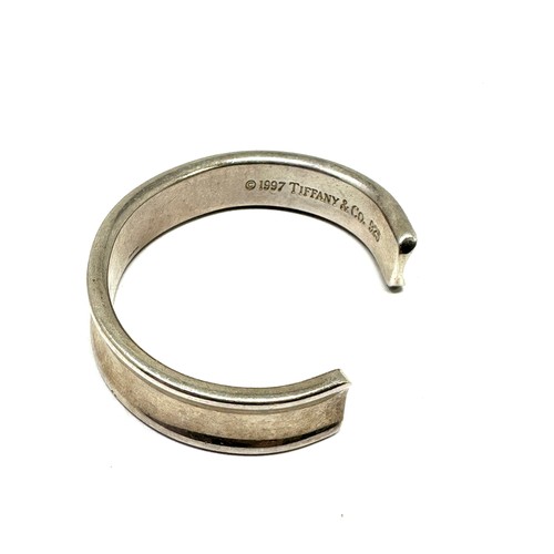 327 - Silver concave torque bangle by designer Tiffany & Co (42g)