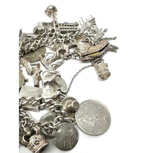 317 - Silver charm bracelet including animal charms (149g)