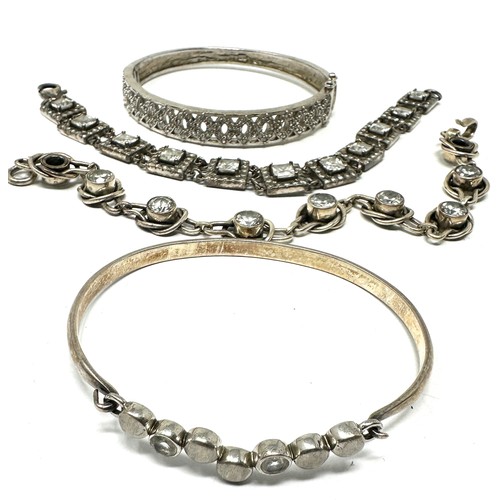 338 - Four silver CZ bracelets & bangles (76g)