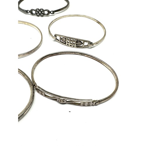 344 - A collection of silver Scottish/Celtic bangles (47g)