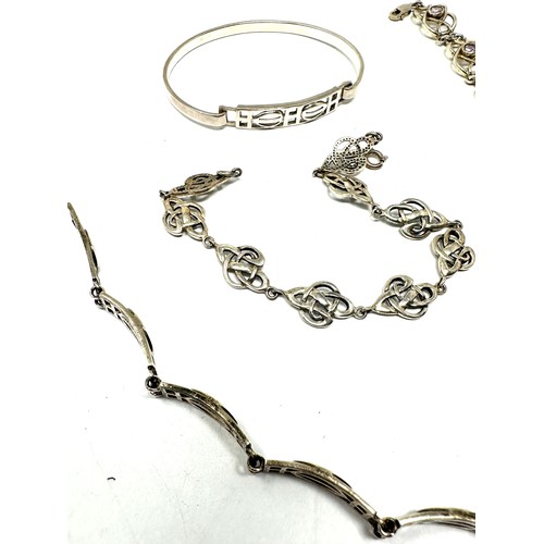 345 - Four silver Scottish/Celtic bracelets including Kit Heath (50g)