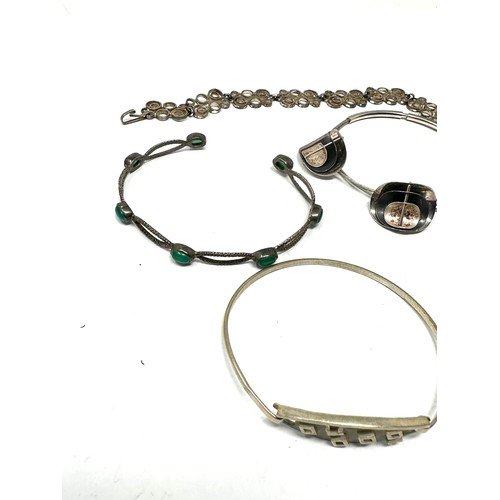 347 - Four silver bangles & bracelet including gemstone (43g)