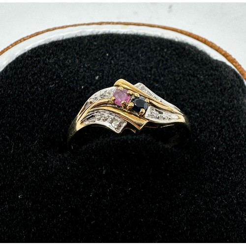 193 - 9ct gold diamond, ruby, and sapphire set dress ring (1.8g)