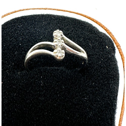 243 - 9ct gold diamond three stone ring (2.3g)