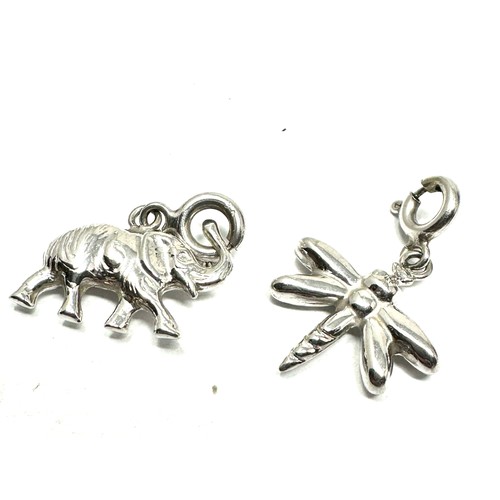 121 - 2 x 9ct white gold animal charms inc. dragonfly & rhino (1.7g)