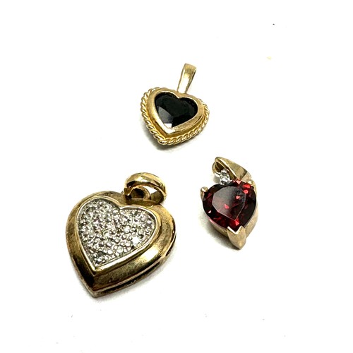 126 - 3x 9ct gold diamond, sapphire & garnet heart shaped pendants (2.7g)