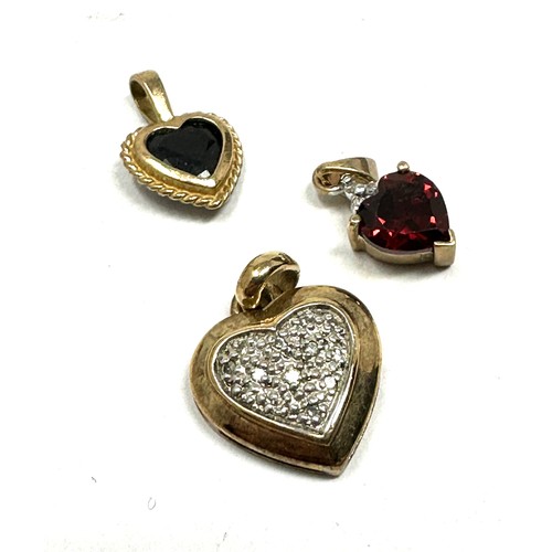 126 - 3x 9ct gold diamond, sapphire & garnet heart shaped pendants (2.7g)