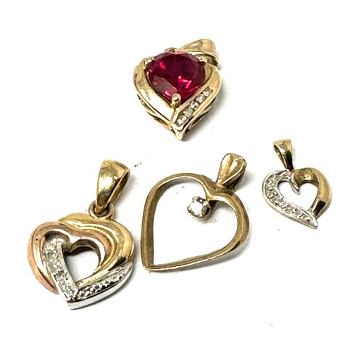 88 - 4 x 9ct gold heart pendants set with diamonds  (3.7g)