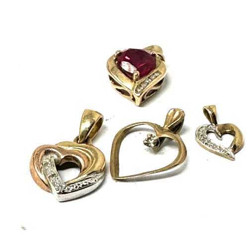 88 - 4 x 9ct gold heart pendants set with diamonds  (3.7g)