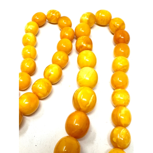 53 - Egg yolk amber bead necklace weight 84g