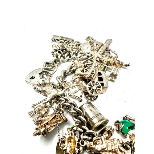 322 - Silver charm bracelet including souvenir charms (83g)