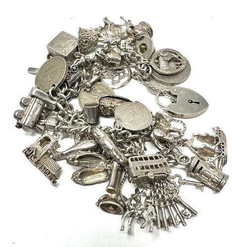 317 - Silver charm bracelet including animal charms (149g)