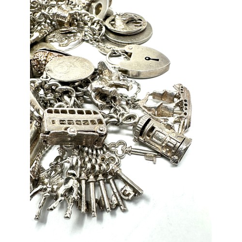 317 - Silver charm bracelet including animal charms (149g)