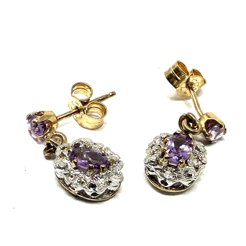 69 - 9ct gold diamond & amethyst earrings weight 2g