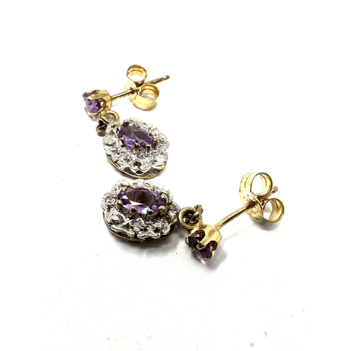 69 - 9ct gold diamond & amethyst earrings weight 2g