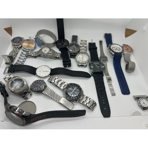 Large selection of assorted wristwatches includes Hugo boss swatch ben sherman police etc all un