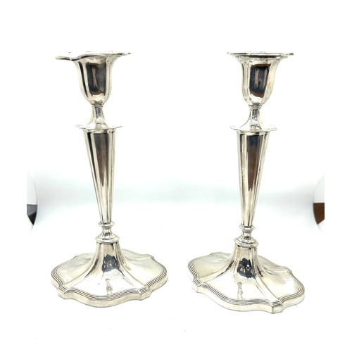 419 - Pair of vintage walker and hall silver candle sticks, filled. 9.5 inches tall