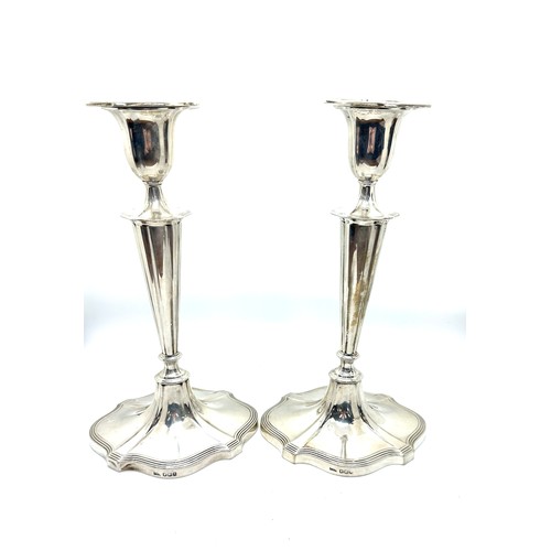 419 - Pair of vintage walker and hall silver candle sticks, filled. 9.5 inches tall